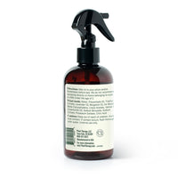 Brown spray bottle with black nozzle on a white background