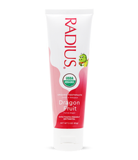 Radius Organic Toothpaste tube for dragon fruit flavor on a white background