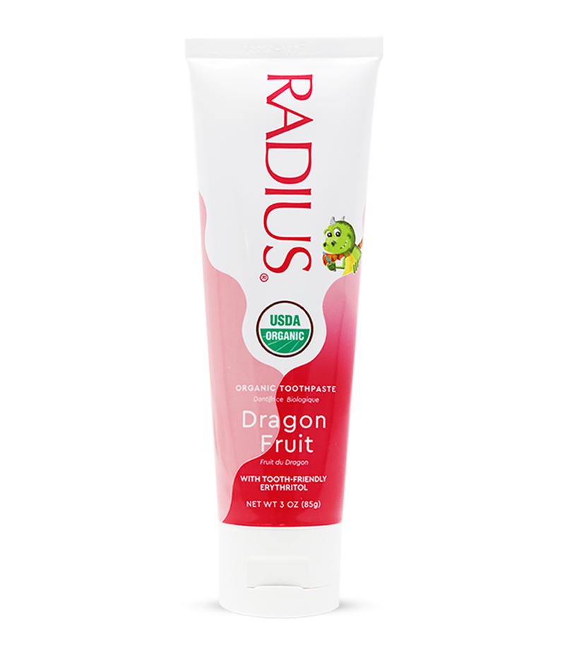 Radius Organic Toothpaste tube for dragon fruit flavor on a white background
