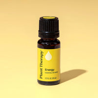 Bottle of Plant Therapy Energy essential oil blend on a yellow background