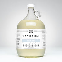 Large bottle of hand soap with a label on a white background
