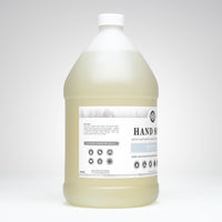 Large bottle of hand soap with a label on a white background