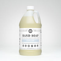 Gallon jug of hand soap with a label on a white background