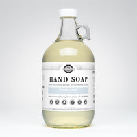 Hand soap bottle with a label on a white background