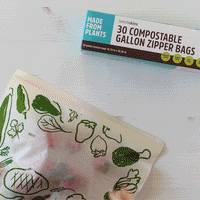 GIF of hands putting strawberries into a zipper bag
