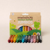 Pack of Honeysticks Beeswax Crayons Jumbos with colorful crayons on a beige background