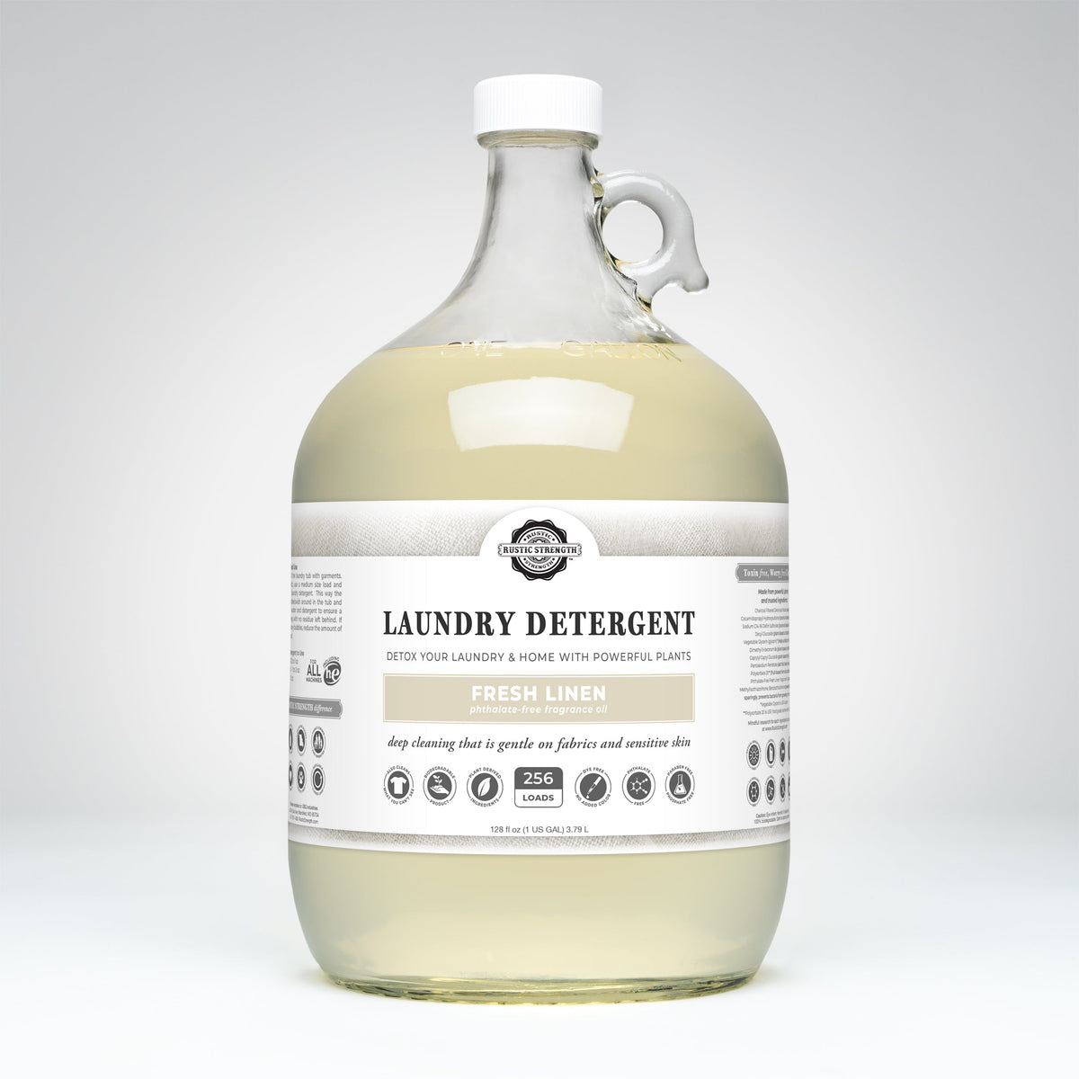 A large clear plastic jug of laundry detergent with a white cap and handle, filled with pale yellow liquid. The front label reads 'The Laundry Company' and 'Laundry Detergent' in 'Fresh Linen'. Main image