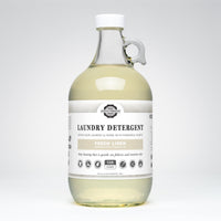 Bottle of laundry detergent with a label on a white background