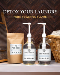 Three bottles of laundry products with labels on a wooden background, featuring text 'Detox Your Laundry with Powerful Plants'.