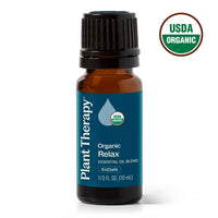 Plant Therapy Organic Relax essential oil blend in a 10 mL amber glass bottle with a black cap and blue label, shown on a white background with a USDA Organic seal in the top right.