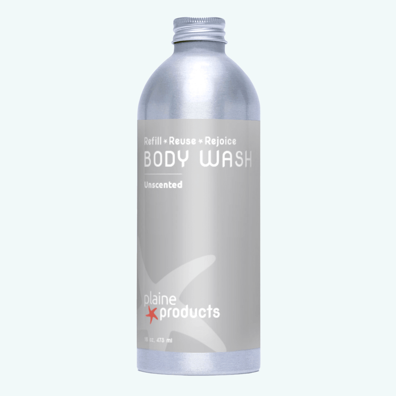 Plaine Products body wash bottle on a white background