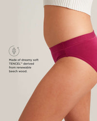 Person wearing a magenta Tencel underwear with a neutral background