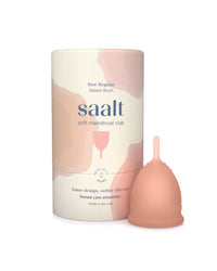 Pink menstrual cup with packaging labeled 'saalt' on a white background
