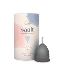 A Saalt soft menstrual cup in mist grey shown next to its cylindrical packaging container on a clean white background.