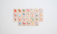Alphabet blocks with letters and illustrations on a white background
