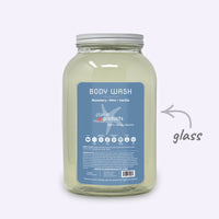 Large jar of body wash with a blue label on a white background
