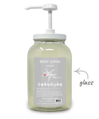 Glass body wash bottle with pump and 'plane products' label on a white background