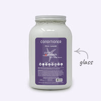 Plaine Products conditioner jar with purple label on a white background