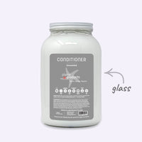 Plaine Products conditioner container on a white background