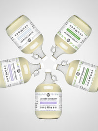 Five bottles of laundry detergent arranged in a circular pattern on a light gray background.