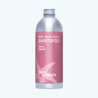 Plaine Products shampoo bottle with pink label on a white background