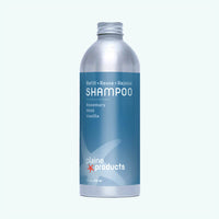 Plaine Products shampoo bottle on a white background
