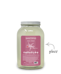 Plaine Products shampoo jar with cherry almond scent on a white background
