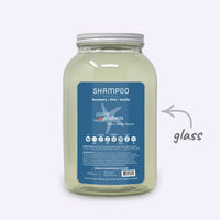 Plaine Products shampoo jar with blue label on a white background