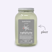 Plaine Products shampoo jar with label on a white background