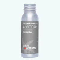 Unscented shampoo bottle with 'plaine products' label on a white background